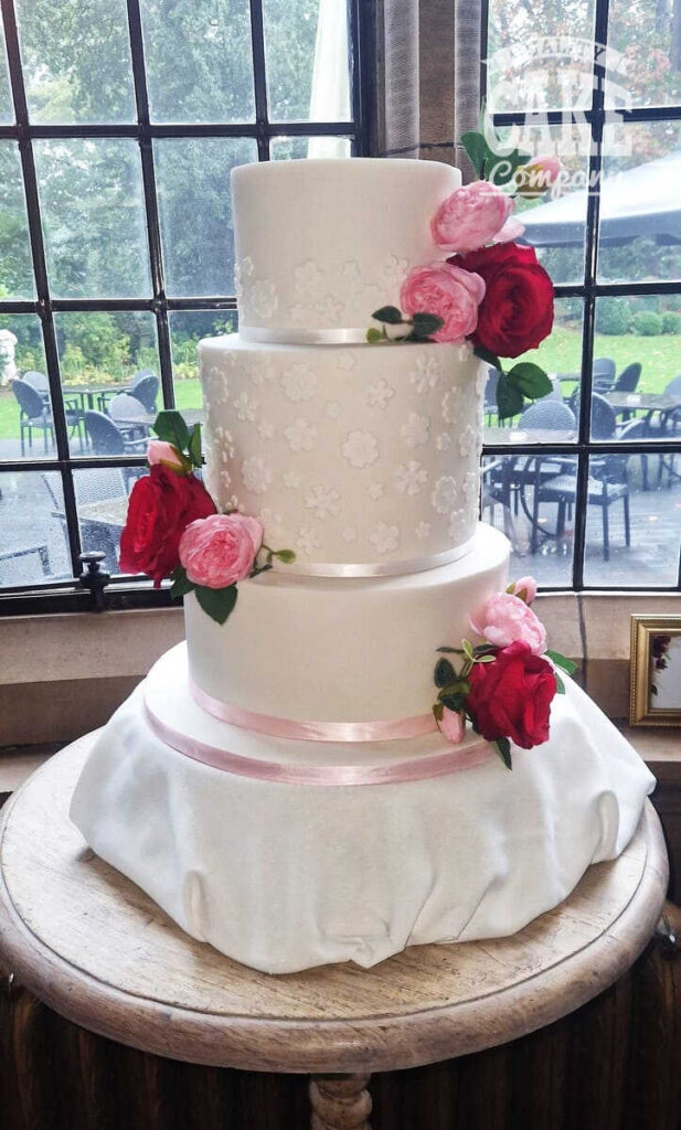 three tier white floral wedding cake