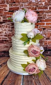 three-tier ribbed buttercream wedding cake silk peonies - Tamworth