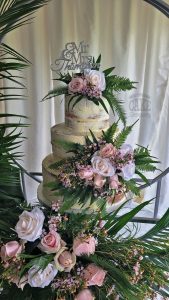 three-tier ribbed buttercream wedding cake - full of fresh flowers - Tamworth
