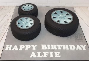 Number 80 shaped birthday cake tyre motor theme - Tamworth