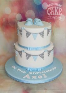 two tier booties and bunting Christening cake - tamworth