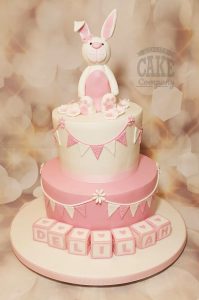 Two tier pink bunny bunting and blocks Christening cake - Tamworth