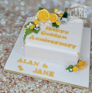 square golden anniversary floral cake with champagne glasses - Tamworth
