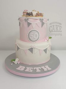 two tier afternoon tea theme cake pastel pink and grey - Tamworth