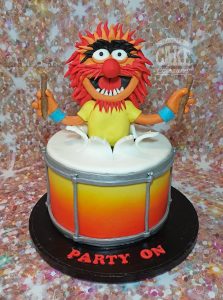 animal from the muppets bursting out of a drum theme cake - Tamworth