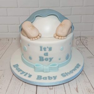 Baby bum on a dotty cake with a bow baby shower cake - tamworth