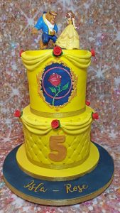 two tier yellow beauty and beast inspired cake - Tamworth