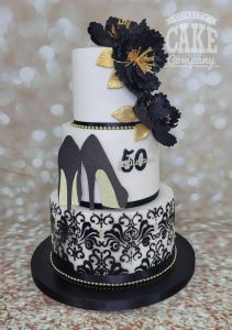 three tier blackand gold shoe theme stencil birthday cake - tamworth