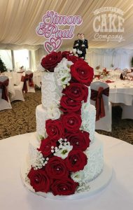 three tier white piped wedding cake with fresh red roses - tamworth