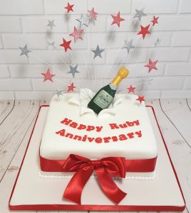 ruby anniversay champagne bottle starburst cake - Tamworth
