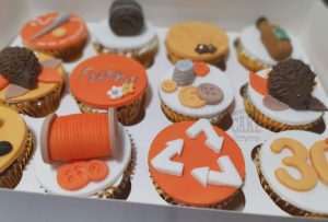 orange hobby theme cupcakes - Tamworth