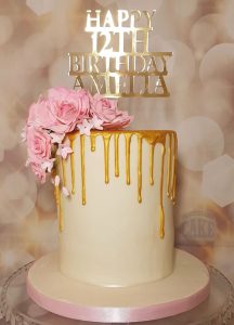 tall elegant gold drip pink flowers birthday cake - tamworth