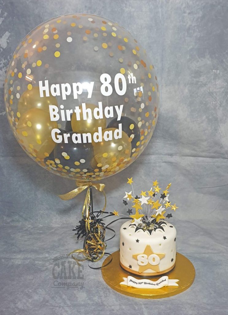gold and black starburst 80th birthday cake - tamworth