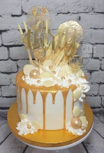 gold theme drip cake modern - tamworth