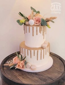 Gold Two tier drip wedding cake fresh flowers Macarons Tamworth West Midlands Staffordshire