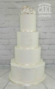 All white classic four tier wedding petal tier, initials and simple flowers Tamworth West Midlands Staffordshire