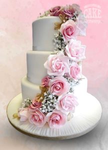 Cascade of pink roses and hessian bows wedding cake three tier Tamworth West Midlands Staffordshire