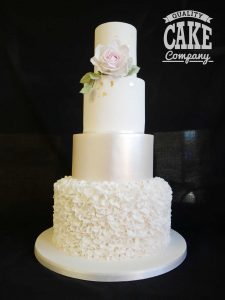 Classic white wedding cake pearl finish with ruffles four tier Tamworth West Midlands Staffordshire