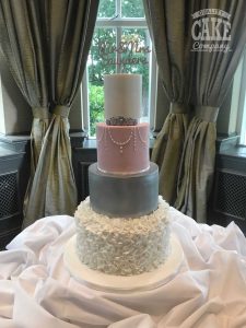 Elegant swagging with ruffles piped pearls, silver pink wedding four tier cake Tamworth West Midlands Staffordshire