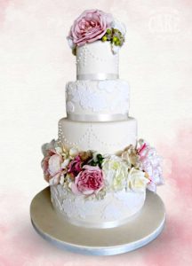 Luxury wedding cake ivory and whtie classic piped pearls and lace soft dusky pink flowers Tamworth West Midlands Staffordshire