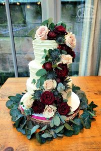 Fresh flower ribbed buttercream cake cascade winter rich colours wedding three tier Tamworth West Midlands Staffordshire