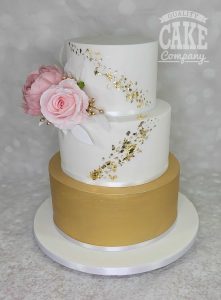 Gold leaf and pure gold tier cake with pink flowers wedding cake Tamworth West Midlands Staffordshire