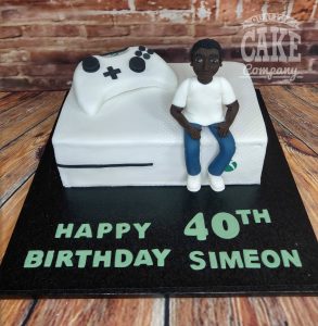 lad sat on xbox console and controller - novelty cake - Tamworth