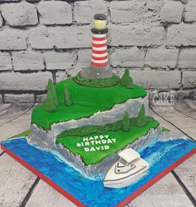 lighthouse and boat novelty birthday cake - tamworth