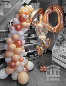 Organic self supporting demi arch rose gold blush balloon display with bubble and number balloons - Tamworth