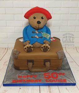 large paddington bear figure on suitcase novelty cake - Tamworth