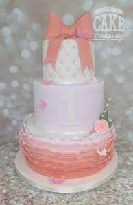 three tier peach ruffle first birthday cake - tamworth