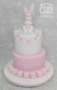 two tier pink and white bunny bunting blocks christening cake - Tamworth
