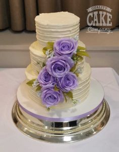 Purple flower cascade ribbed buttercream wedding three tier cake Tamworth West Midlands Staffordshire