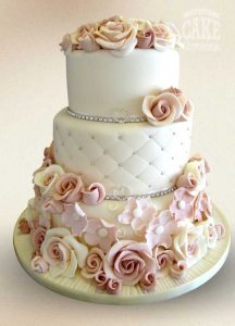 Pretty elegant roses flowers in pinks and whties. Quilted diamante wedding cake Tamworth West Midlands Staffordshire