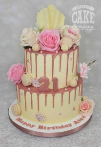 two tier rose gold drip cake with flowers - tamworth