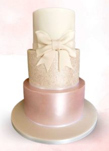 Ivory large bow glitter and pink shimmer three tier wedding cake Tamworth West Midlands Staffordshire