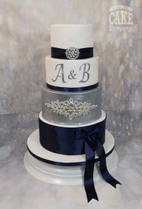 Silver and Navy blue wedding ribbons, bling and monogram four tier cake Tamworth West Midlands Staffordshire