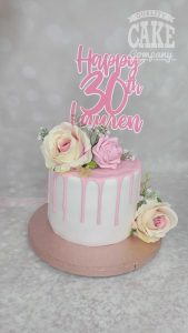 simple pink and white drip cake with personalised topper - Tamworth