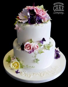Two tier 25th birthday cake with colourful flowers Tamworth West Midlands Staffordshire