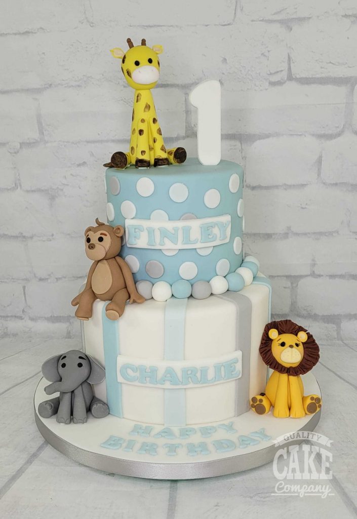 two tier spots and stripes first birthday jungle animal cake - tamworth