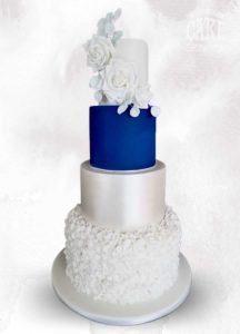 Classic white with royal blue tier, ruffles and roses four tier wedding Tamworth West Midlands Staffordshire