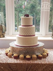 Three tier classic white quilted with burgundy ribbons with cupcakes wedding Tamworth West Midlands Staffordshire