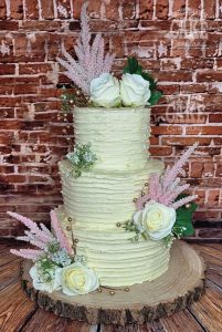 Three tier ribbed buttercream wedding cake silk roses astible large flowers Tamworth West Midlands Staffordshire