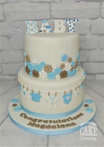 two tier baby buttons leaving to have baby cake - tamworth