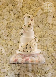 Wedding cake five tier sugar flower cascade white with rose gold touches floral wall Tamworth West Midlands Staffordshire