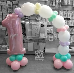 kids first birthday pastel pink table balloon arch - Tamworth