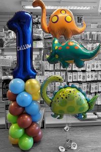 first birthday column and dinosaur balloons - Tamworth
