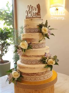 four tier semi naked soft lemon fresh flower wedding cake Tamworth West Midlands Staffordshire