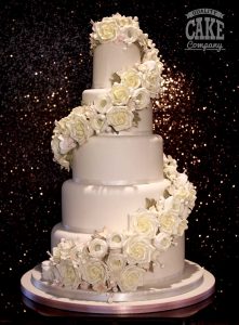 full floral wrap around cascade in white wedding cake five tier Tamworth West Midlands Staffordshire