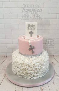 two tier holy communion pink ruffle cake - tamworth